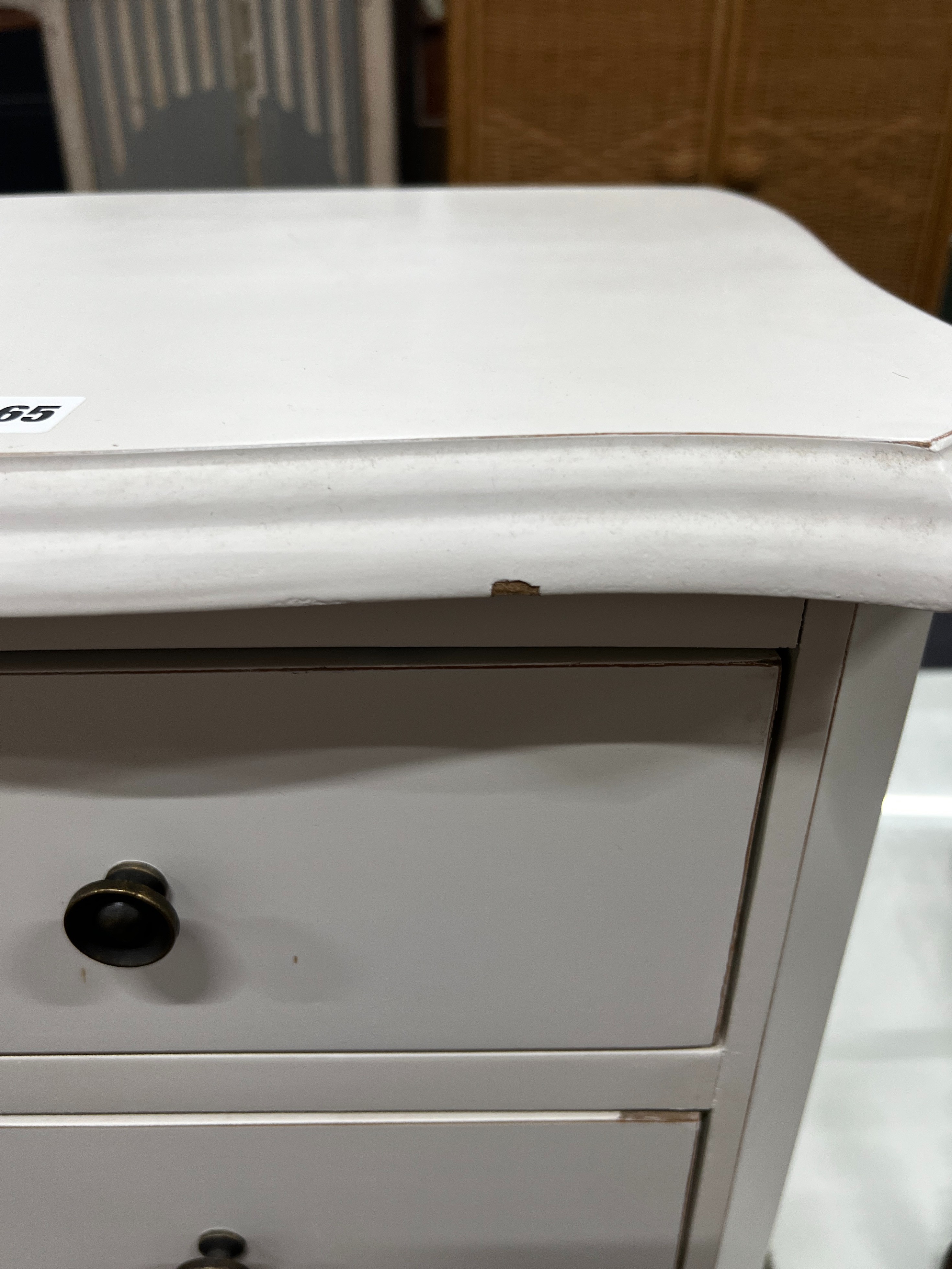 A pair of painted serpentine front three drawer bedside chests, width 45cm, depth 38cm, height 65cm